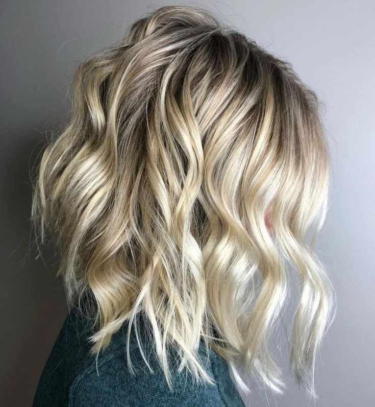 The best Layered Bob with Beach Waves and Blonde Balayage 2024
