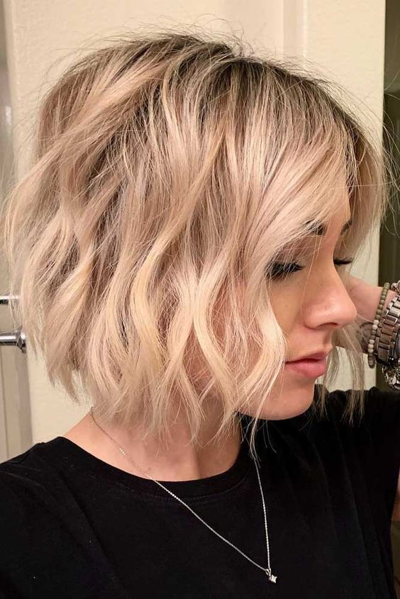 The best Layered Bob with Beach Waves and Blonde Balayage 2024 4
